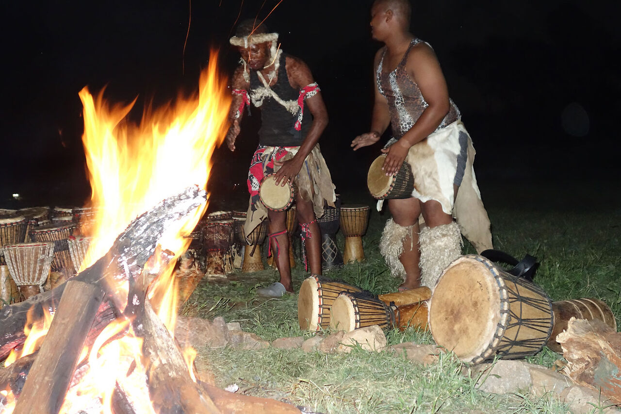 6 Bongani and Boxer Drumming around Fireplace